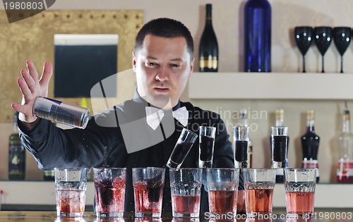 Image of pro barman prepare coctail drink on party