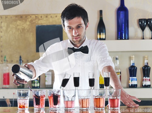 Image of pro barman prepare coctail drink on party