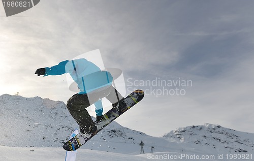 Image of snowboarder extreme jump