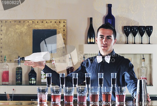 Image of pro barman prepare coctail drink on party