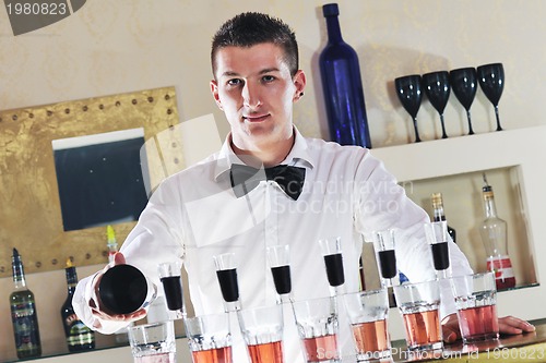 Image of pro barman prepare coctail drink on party