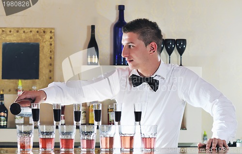 Image of pro barman prepare coctail drink on party