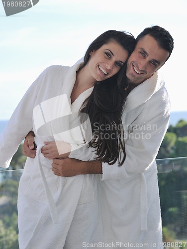 Image of couple relaxing on balcony