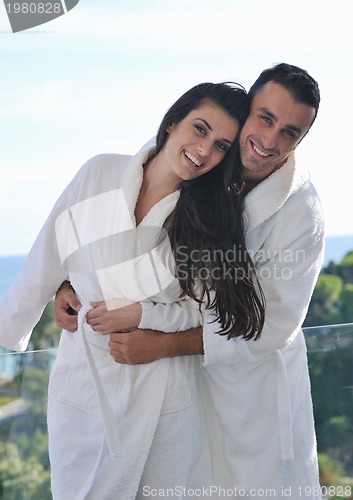 Image of couple relaxing on balcony