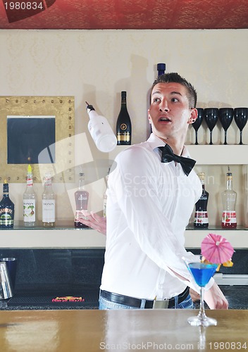 Image of pro barman prepare coctail drink on party