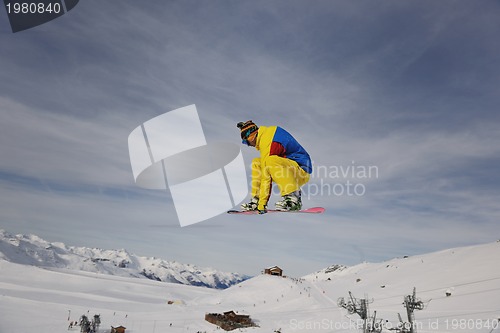 Image of snowboarder extreme jump