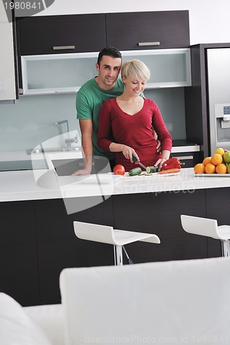 Image of young couple have fun in modern kitchen