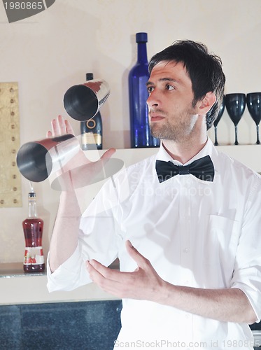 Image of pro barman prepare coctail drink on party