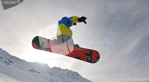 Image of snowboarder extreme jump