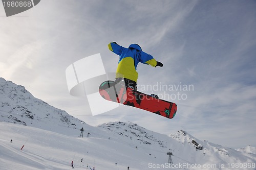 Image of snowboarder extreme jump