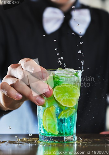 Image of pro barman prepare coctail drink on party