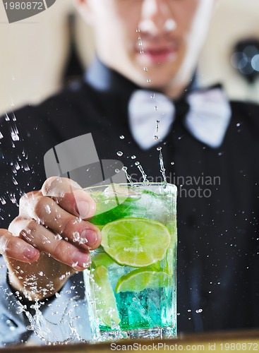 Image of pro barman prepare coctail drink on party