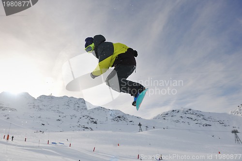 Image of happy young man have fun at winter on mountain peak