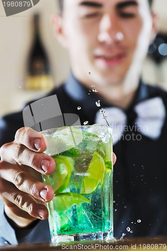 Image of pro barman prepare coctail drink on party