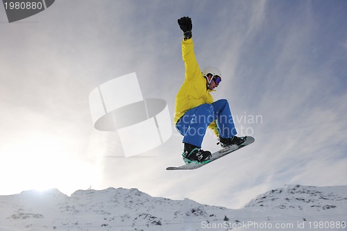 Image of happy young man have fun at winter on mountain peak