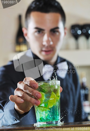 Image of pro barman prepare coctail drink on party