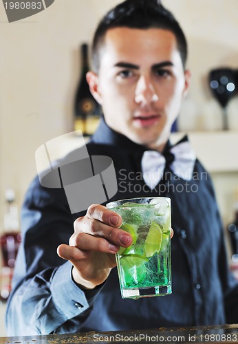 Image of pro barman prepare coctail drink on party