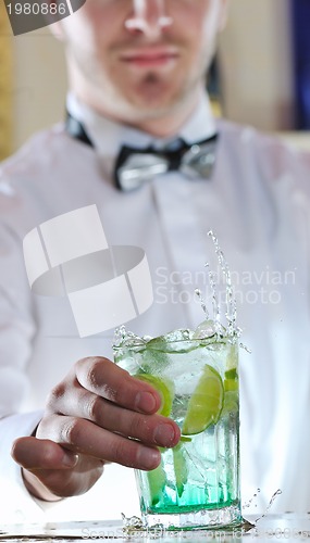 Image of pro barman prepare coctail drink on party