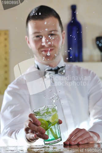 Image of pro barman prepare coctail drink on party