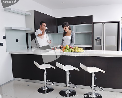 Image of young couple have fun in modern kitchen