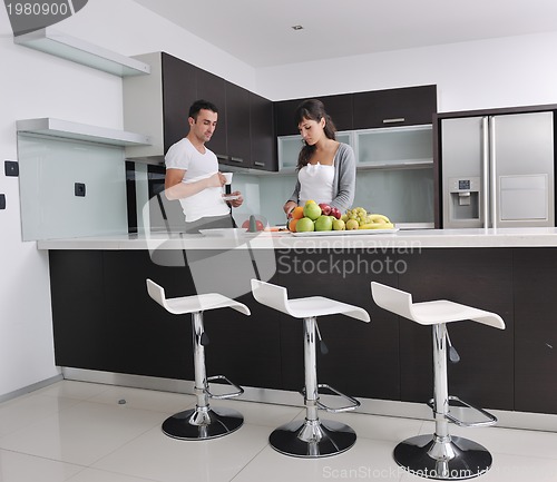 Image of young couple have fun in modern kitchen