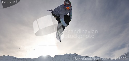 Image of snowboarder extreme jump