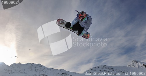 Image of snowboarder extreme jump