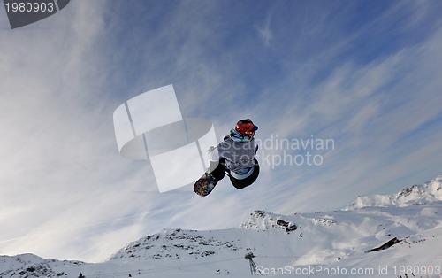 Image of happy young man have fun at winter on mountain peak