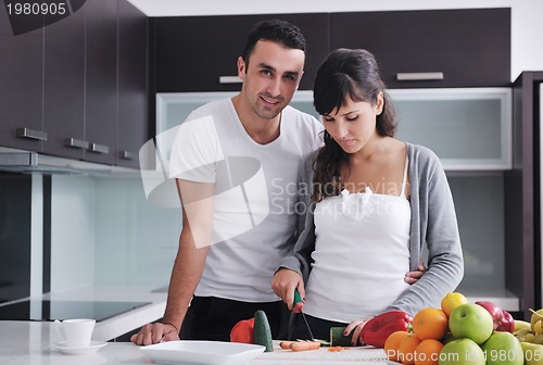 Image of young couple have fun in modern kitchen