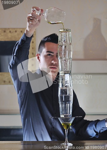 Image of pro barman prepare coctail drink on party