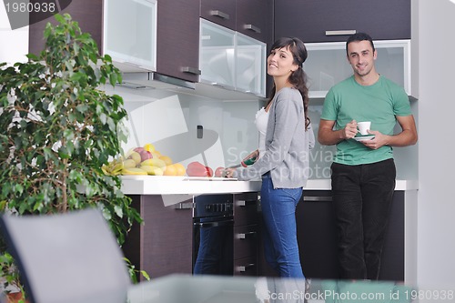 Image of young couple have fun in modern kitchen