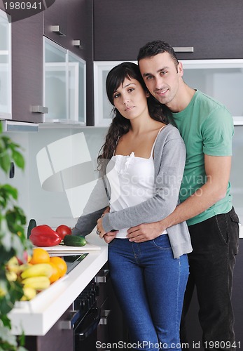 Image of young couple have fun in modern kitchen