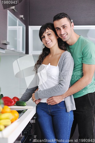Image of young couple have fun in modern kitchen
