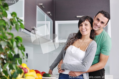 Image of young couple have fun in modern kitchen