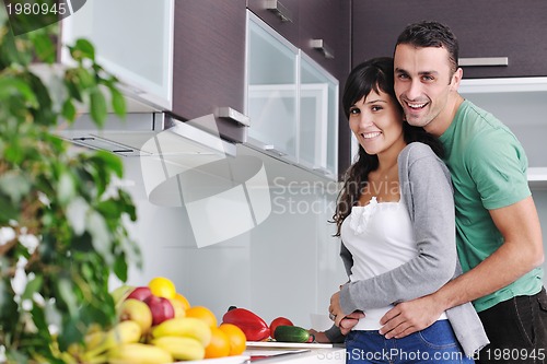 Image of young couple have fun in modern kitchen