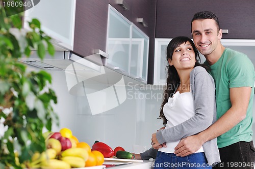 Image of young couple have fun in modern kitchen