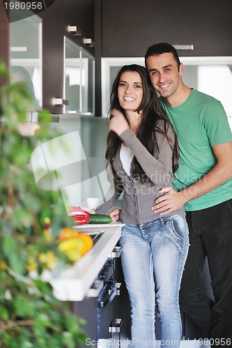 Image of young couple have fun in modern kitchen