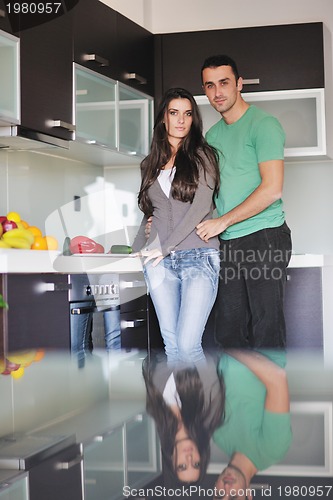 Image of young couple have fun in modern kitchen