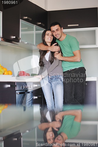 Image of young couple have fun in modern kitchen