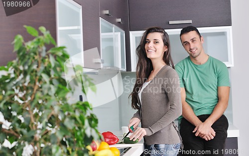 Image of young couple have fun in modern kitchen