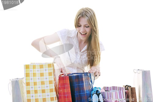 Image of happy young adult women  shopping with colored bags