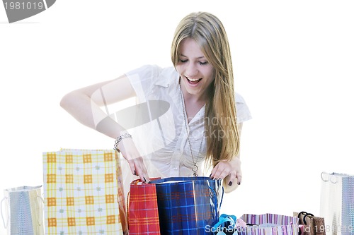 Image of happy young adult women  shopping with colored bags