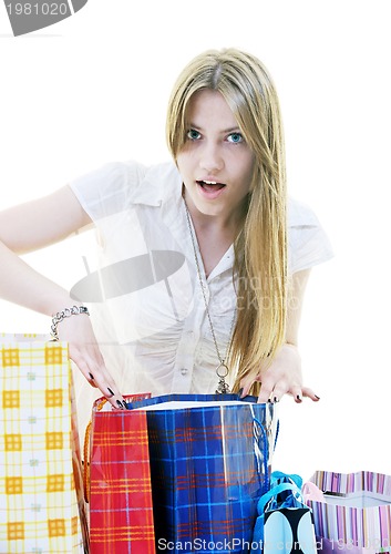 Image of happy young adult women  shopping with colored bags