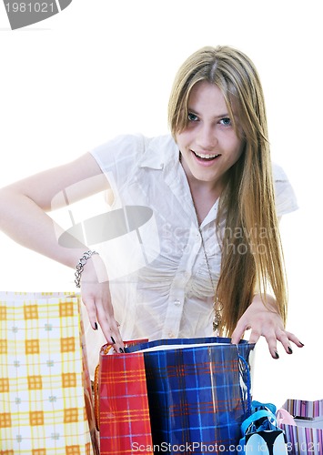 Image of happy young adult women  shopping with colored bags