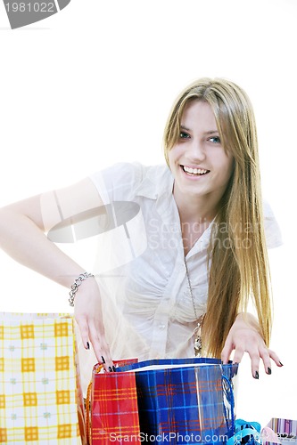 Image of happy young adult women  shopping with colored bags