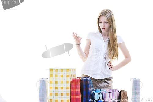 Image of happy young adult women  shopping with colored bags