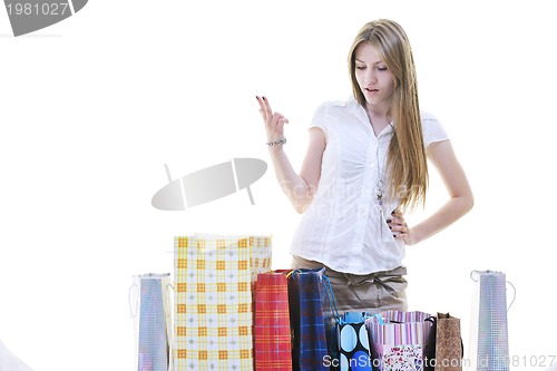 Image of happy young adult women  shopping with colored bags