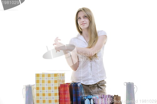 Image of happy young adult women  shopping with colored bags