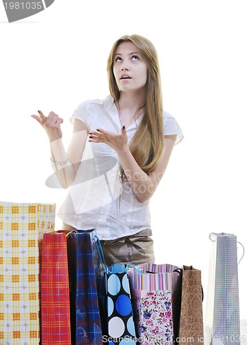 Image of happy young adult women  shopping with colored bags