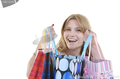 Image of happy young adult women  shopping with colored bags